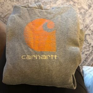 Carhartt Heather Gray Sweatshirt with Vibrant Orange Emblem